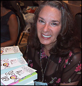Susan signs books