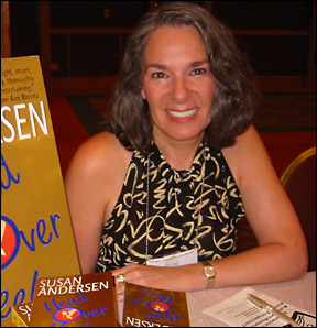 Susan signs books